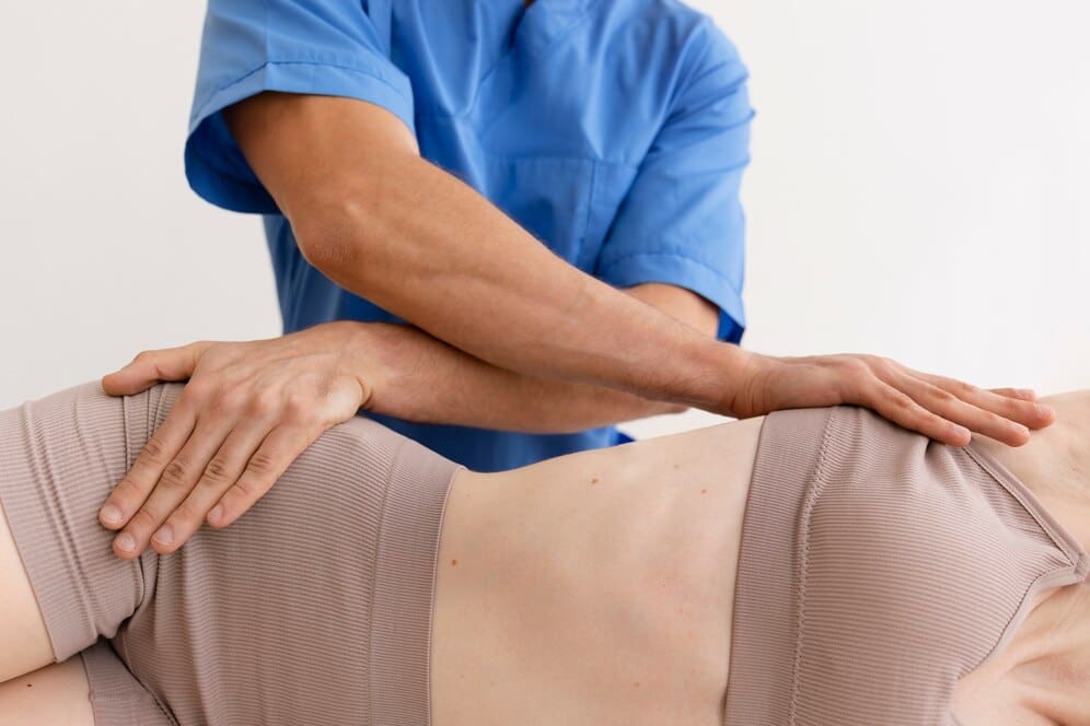 nurse-with-patient-osteopathy-session_23-2149146136